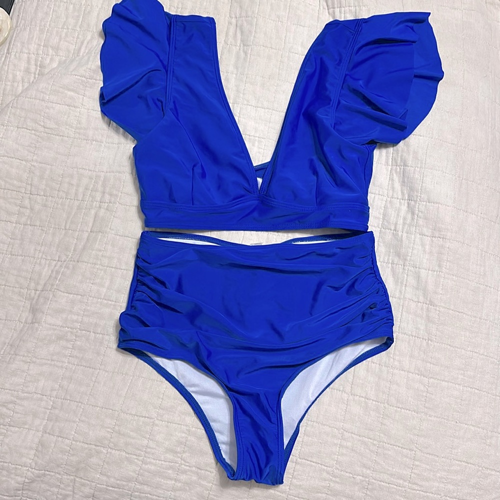 Royal blue high waisted bikini with breathful sleeves. Never worn.